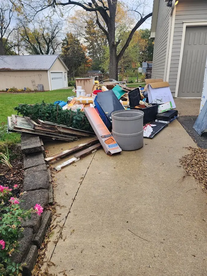 Dumpster being loaded with debris for Commercial Dumpster Rental in New Britain
